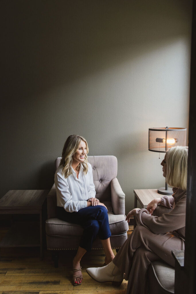 Two people sitting together discussing.