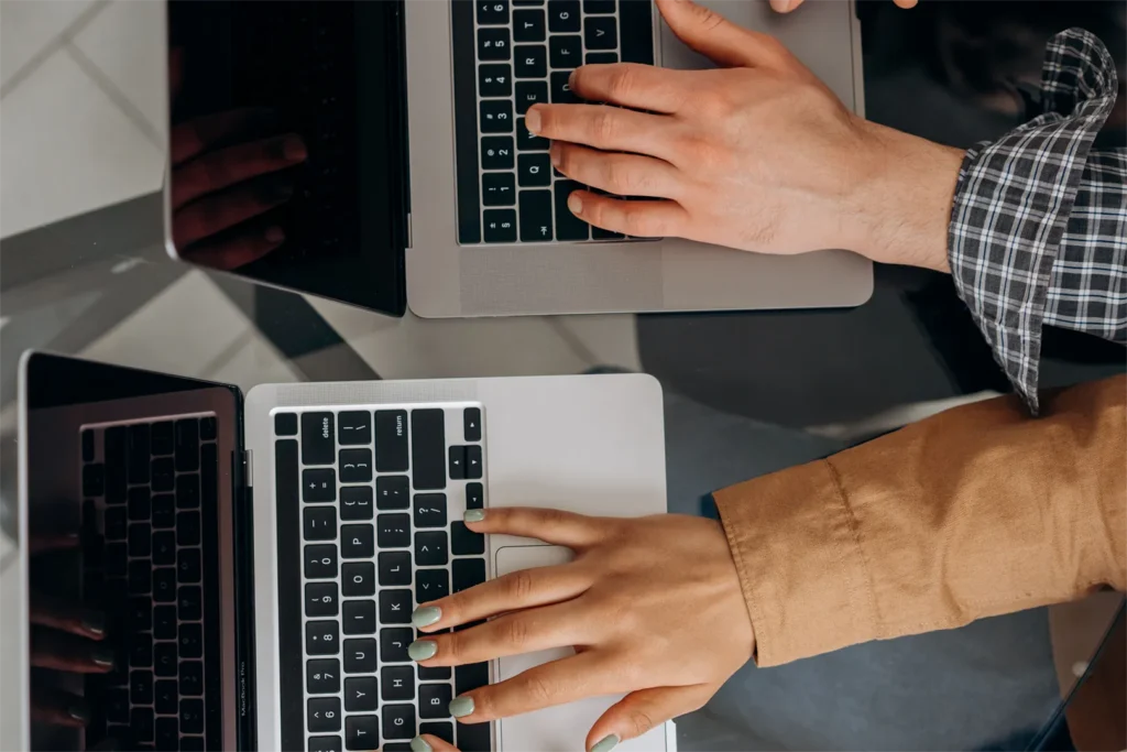 People collaborating on a computer.