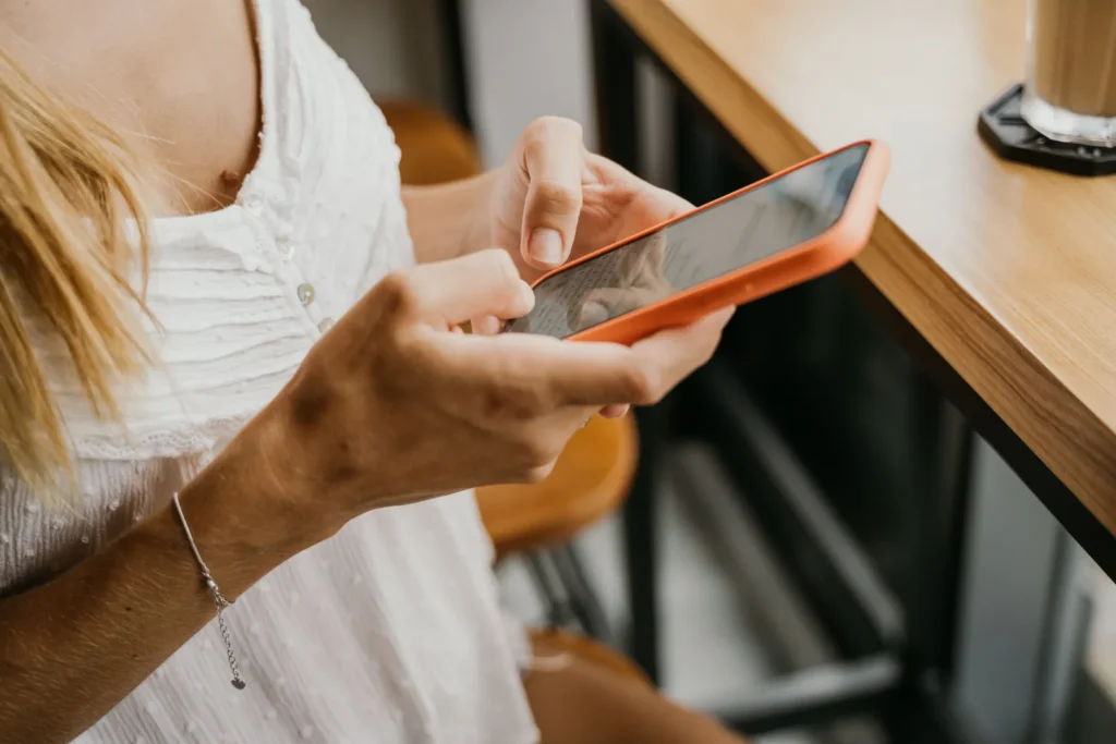 Woman using a phone.